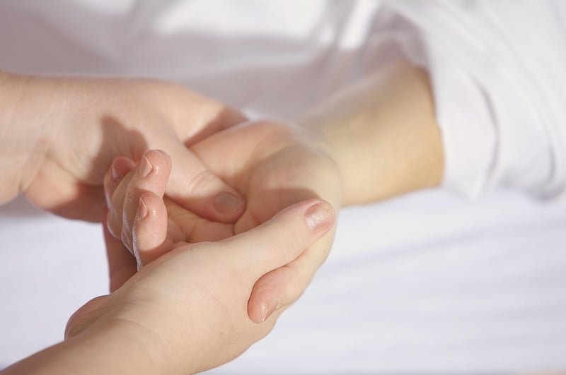 Physical therapist working with patient